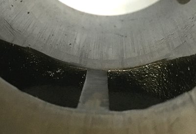 Ring impact prints on lower edge of port.