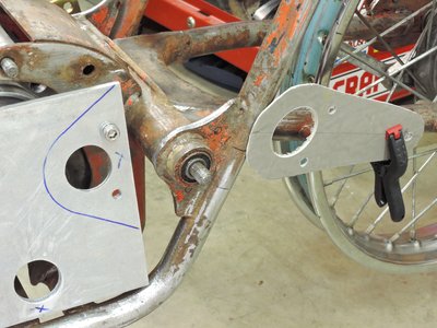 Holes will be drilled into swing arm boss braces