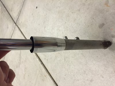 Left fork with the circle nut/ lower fork shroud.