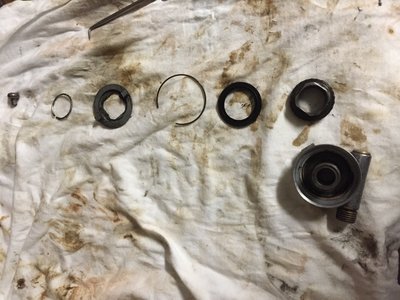 Parts disassembly, before cleaning. The this washer is stuck to the back of the helical gear